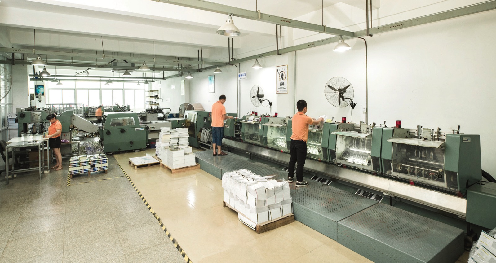 Müller Martini fully automatic saddle-stitching line